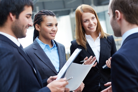 group-of-business-partners-looking-at-their-colleague-during-negotiations-SBI-300723560 (1).jpg